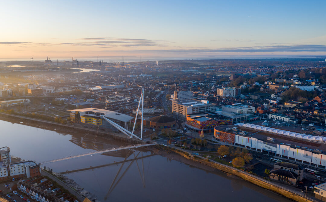 An aerial view at sunrise of Newport city centre, south wales United Kingdom, taken from the River Usk