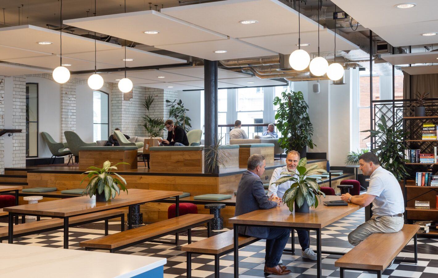 A hospitality-style reception and coffee lounge create a warm welcome.