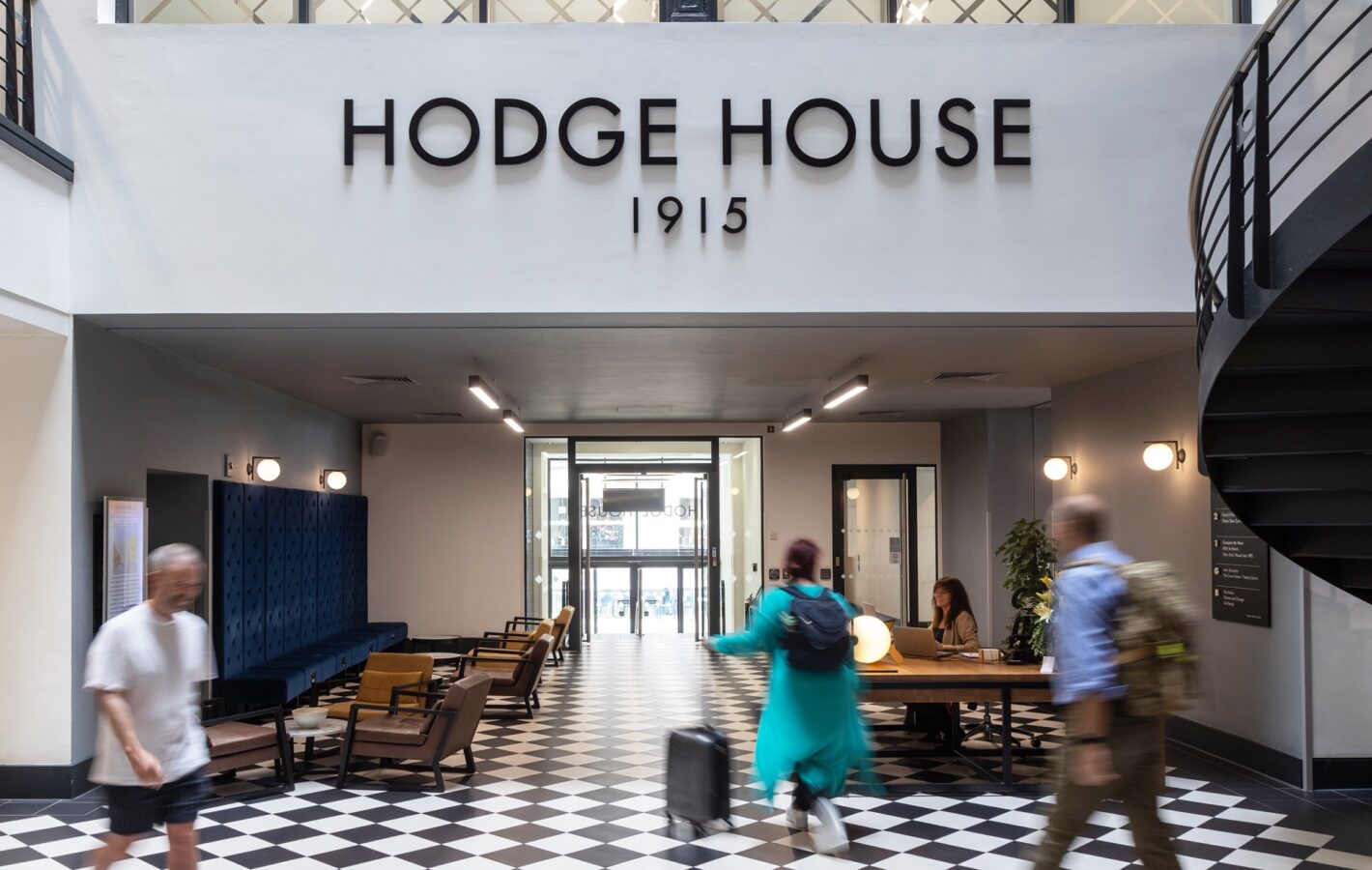 A hospitality-style reception and coffee lounge create a warm welcome.